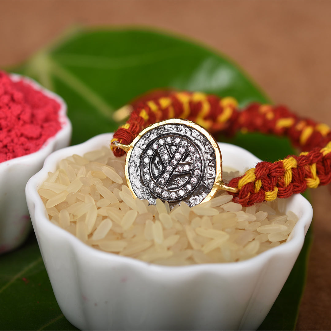 SYMETREE PEACE CHARM RAKHI BRACELET